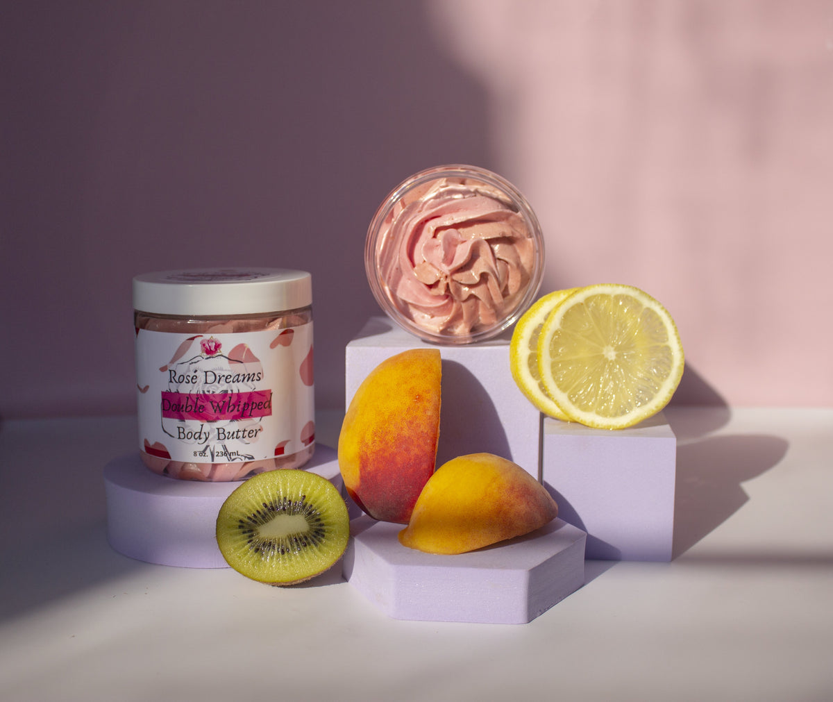Rose Dreams Body Butter with Pink Background and Fruits